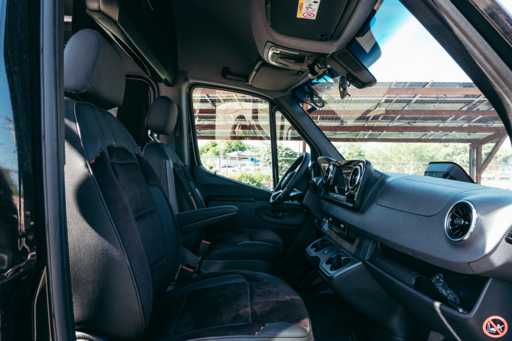 Interior of a comfortable private transfer van with leather seats