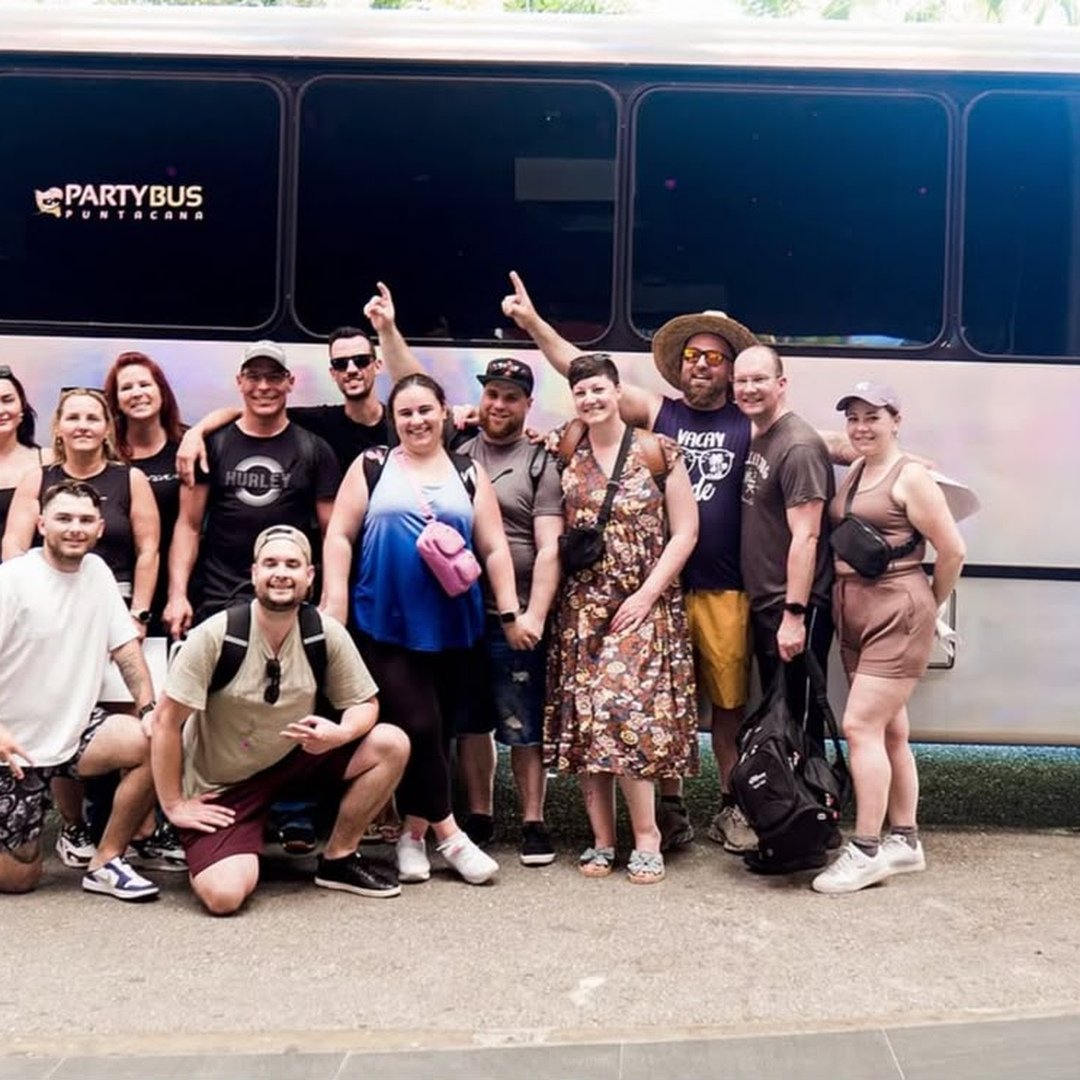 Group posing in front of the Party Bus Punta Cana